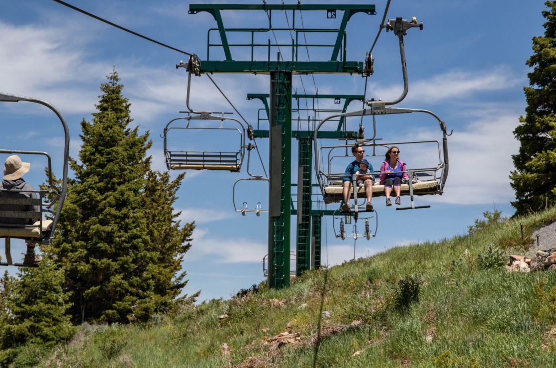 Family on a scenic chairlift ride at Deer Valley in Park City Utah.